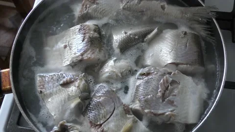 Fish is cooked in a pan Stock Footage 160947847
