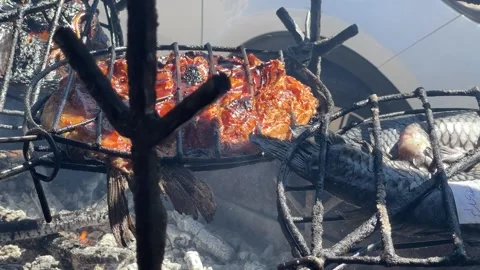 Fish cooked in traditional way Stock Footage 165533351