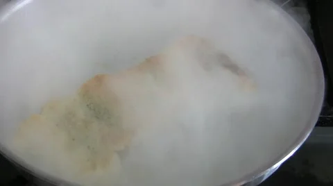 Fish cooking burst into flame! shot. Stock Footage 59923653