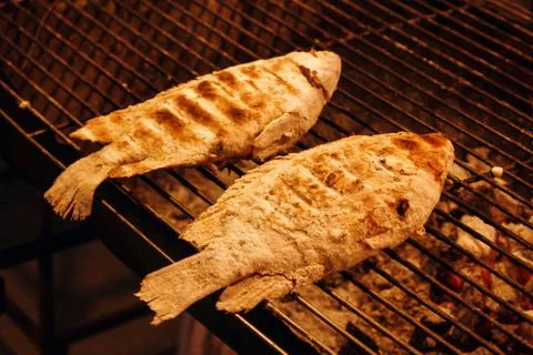 Fish is Cooking on Grill Grid Stock Photos