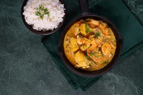 Fish curry with codfish, pollack and shrimps with coconut milk 写真素材