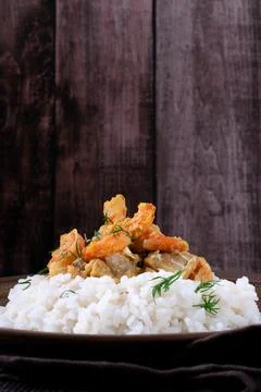 Fish curry with codfish, pollack and shrimps on rice Stock-Fotos