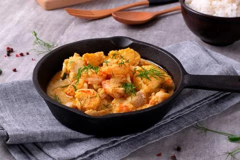 Fish curry with codfish, pollack and shrimps Stock-Fotos