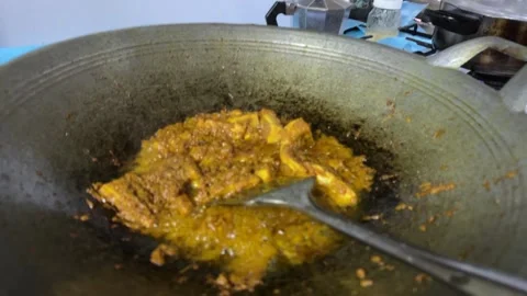 Fish Curry Cooking in a Wok Stock Footage 325386457