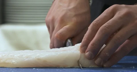 Fish cut (cod) by a great chef Stock Footage 89394854