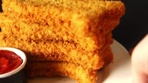 Fish cutlet breaded fish sticks shaped fish nuggets fast food fresh Stock Footage 311464979