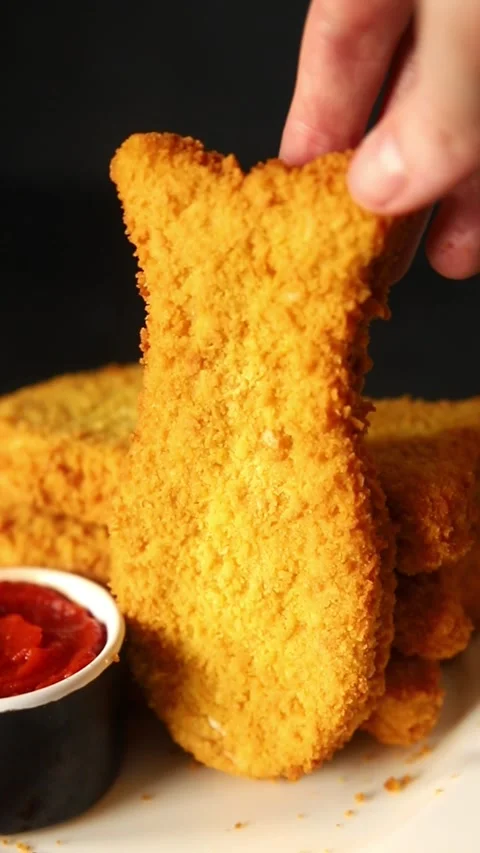 Fish cutlet breaded fish sticks shaped fish nuggets fast food fresh Stock Footage 311464988