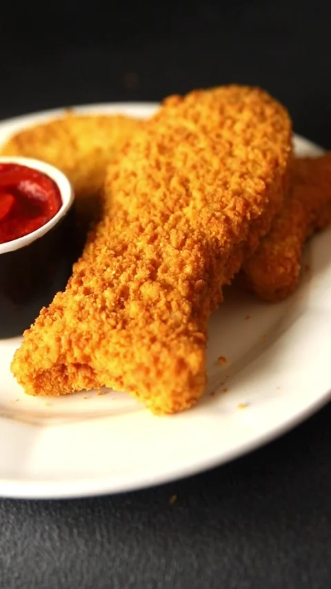Fish cutlet breaded fish sticks shaped fish nuggets fast food fresh Stock Footage 311464990