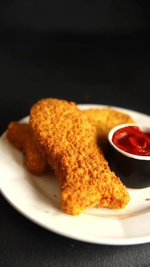 Fish cutlet breaded fish sticks shaped fish nuggets fast food fresh Stock Footage 311464993