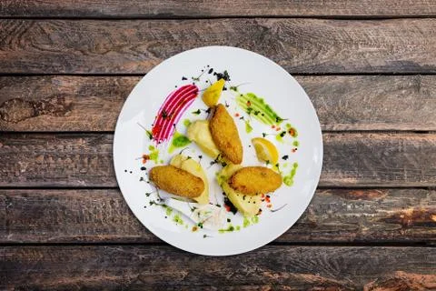 Fish cutlets stuffed with quail eggs with mashed potatoes. Stock Photos