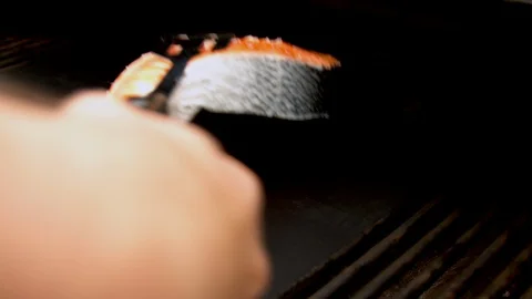 Fish cuts being put on grill Stock Footage 130062461