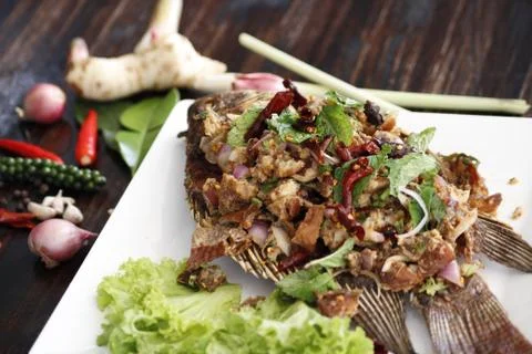 Fish deep fried salad on the table Stock Photos