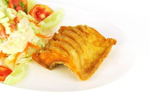 Fish dish - deep fried fish with vegetable salad on white Stock Photos