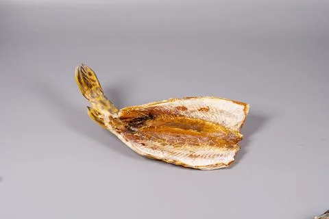 Fish dish displayed against a plain background in a simple setting Fotos Stock