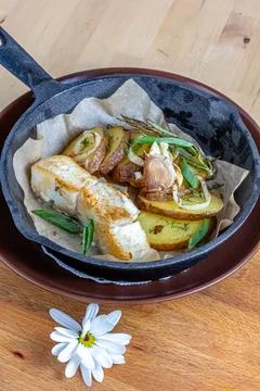 Fish dish - fried fish, fried potatoes and vegetables 스톡 사진