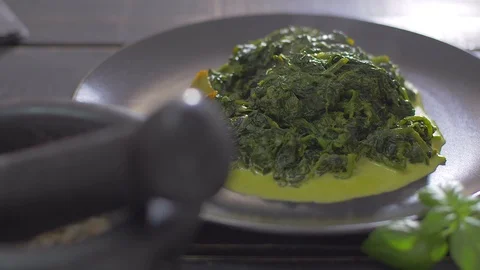 Fish dish with spinach. Place fillets from fish on a spinach couch Video stock 111967909