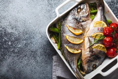 Fish dorado baked with asparagus Stock Photos
