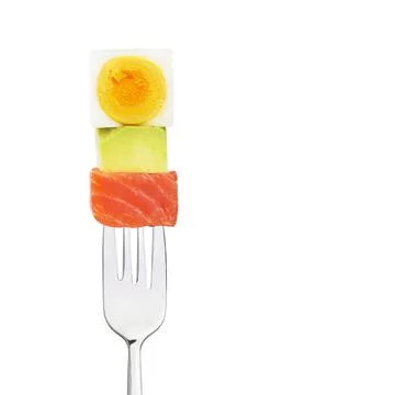 Fish with egg and avocado on a fork. Healthy food. Nutritionology. Stock Photos