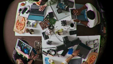 Fish Eye of Cluttered White Tables with Young People Working on Laptops Stock Footage 312459279