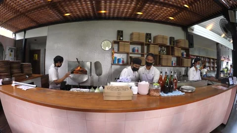 Fish eye shot of chefs preparing pizza in face mask during a covid-19 pandemic Video stock 150004611