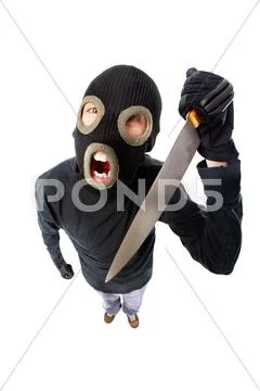 Fish-eye shot of a criminal in mask holding knife Stock-Fotos