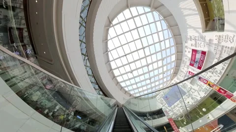 Fish eye view of taking escalator in shopping mall, Beijing, China Stock Footage 203187720