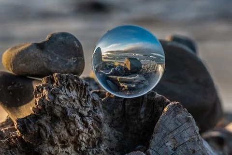 Fish eye view of waves breaking on the shoreline. Stock Photos