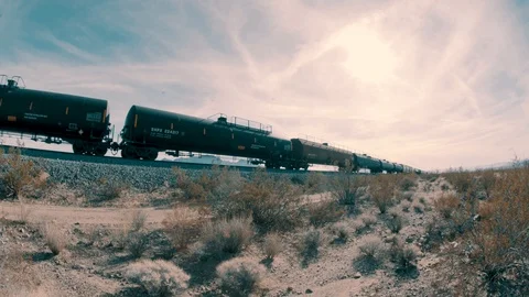 Fish eye wide angle shot of a industrial transport train passing through Vidéo 94044864
