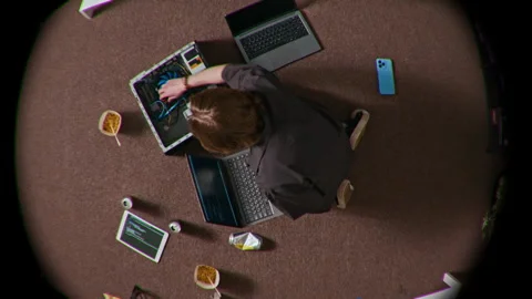 Fish Eye of Young Person Sitting on Floor Working with Wires in Computer Tower Stock Footage 312456089