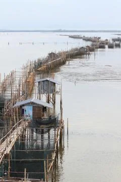 Fish farm (floating net for keeping fish in water) at chanthaburi river thail Stock Photos