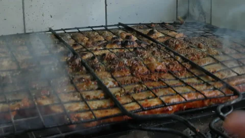 Fish fillets are cooked on the grill. Stock Footage 163236429