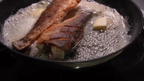 Fish Fillets Frying with Bubbling Butter. Stock Footage 258563252