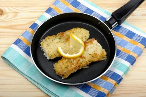 Fish fillets in the pan Stock Photos