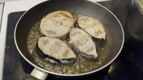 Fish fillets from a swordfish in a pan Stock Footage 157820130