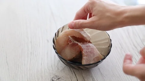 The fish  in a foil with a lemon red chilli pepper Stock Footage 106774122