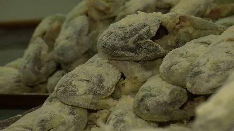 Fish fried in a frying pan until golden brown,Pieces of fresh fish are fried in  Stock Footage 90238741