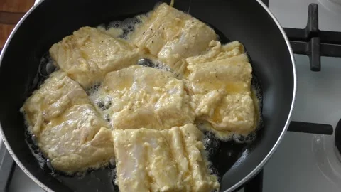 Fish is fried in a pan Stock Footage 164900530