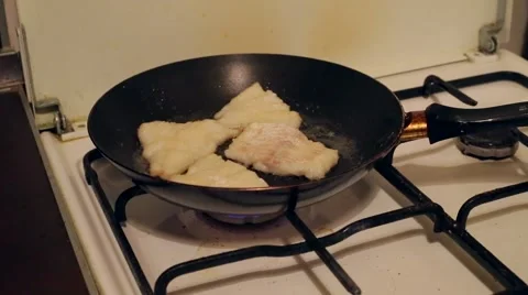 The fish is fried in a pan on the old gas stove Stock Footage 46401803