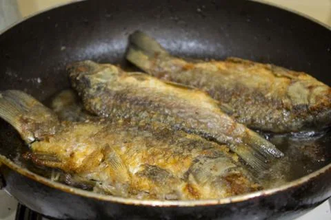 Fish fried on pan Foto stock