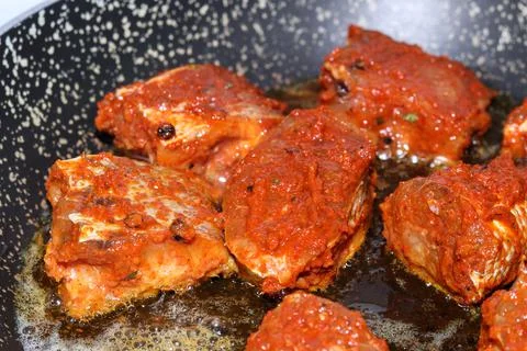 Fish is fried in a pan Foto stock