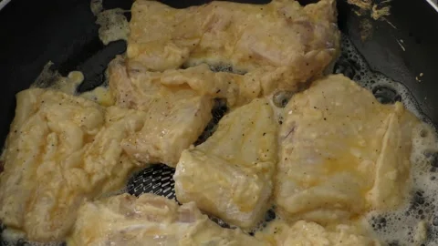 Fish is fried in a pan, view from the top Stock Footage 164189755