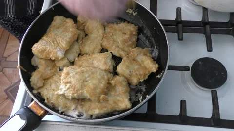 Fish is fried in a pan, view from the top Stock Footage 164189878