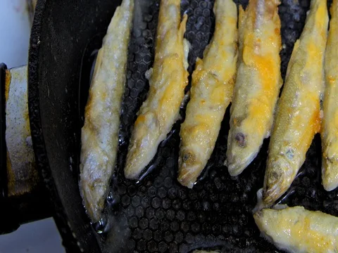Fish fried in a skillet. Smelt. Stock Footage 73514643
