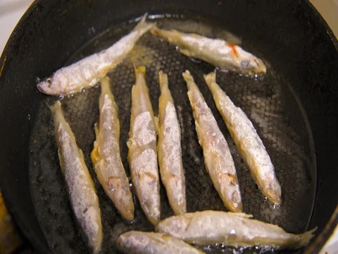 Fish fried in a skillet. Smelt. Stock Footage 73515149