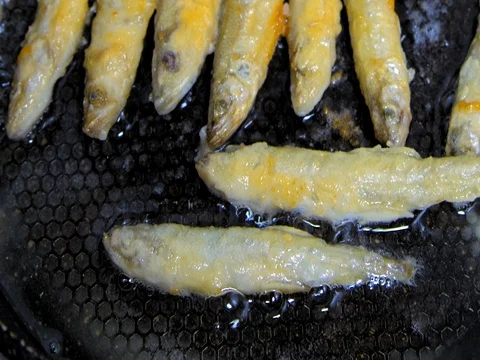 Fish fried in a skillet. Smelt. Stock Footage 73515513