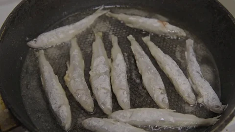 Fish fried in a skillet. Smelt. S-log Stock Footage 70529468