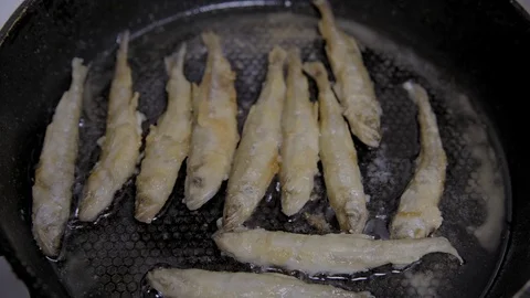 Fish fried in a skillet. Smelt. S-log Stock-Footage 70531771