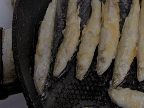 Fish fried in a skillet. Smelt. S-log Stock Footage 73515976