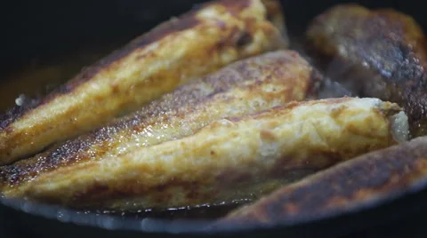 Fish frying in a pan Stock Footage 61488238