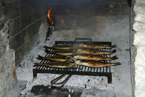 Fish on the grill Stock Photos